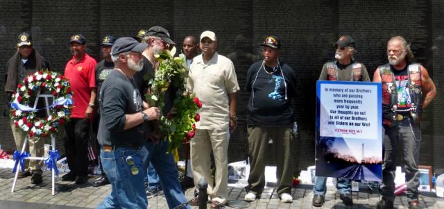 Doug Rawlings, left, and the author leaving a wreath at the Wall on Memorial Day. Photo by Ellen Davidson
